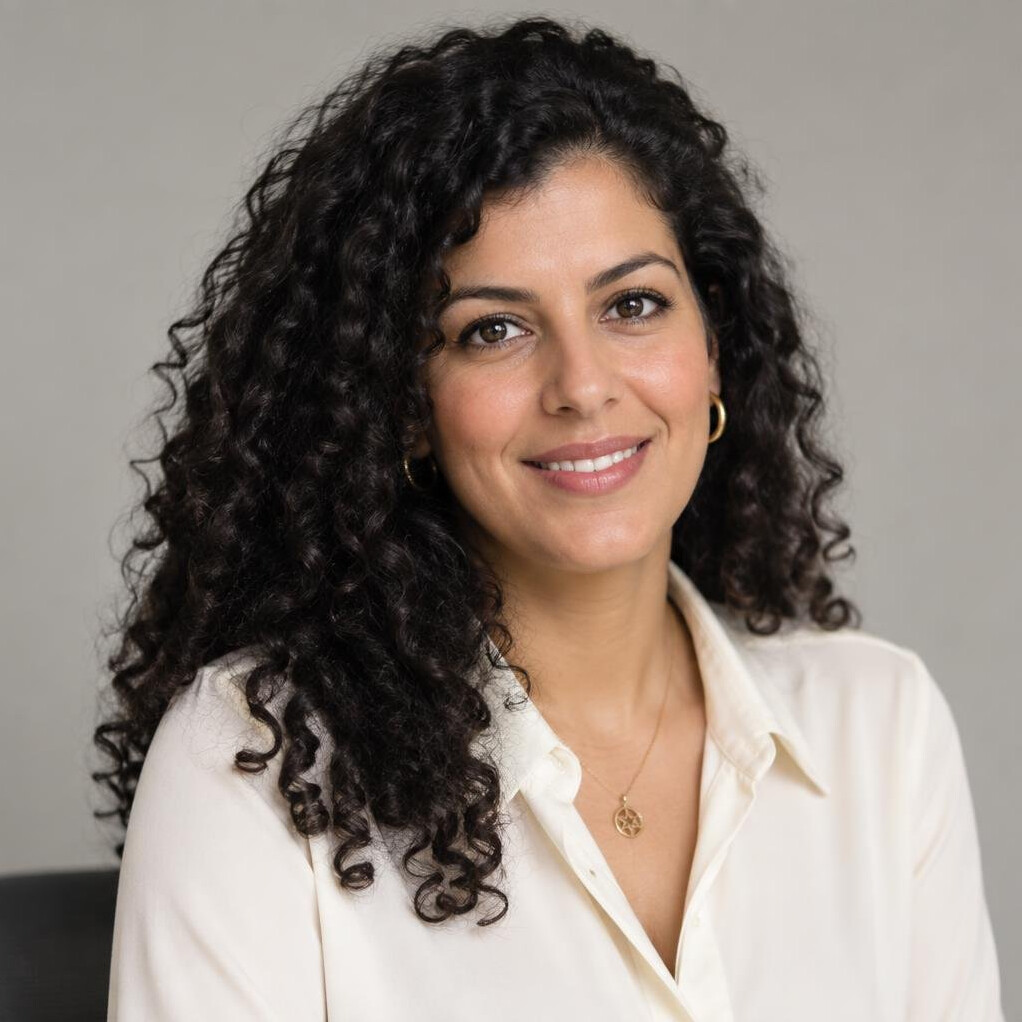 Portrait of a woman with dark curly hair